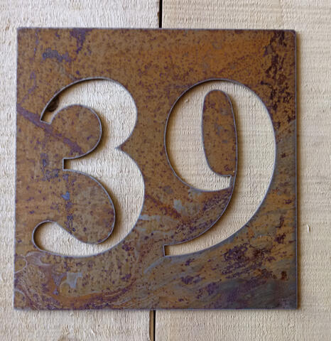 Square rusted steel address sign